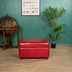 red rectangular footrest (in leather) in ambience