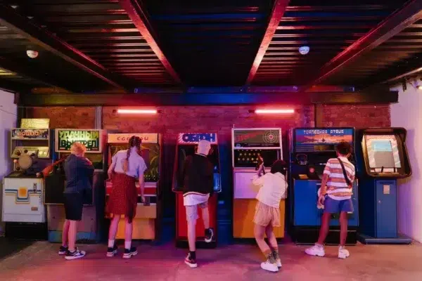 Children playing arcade games in a fun indoor entertainment center