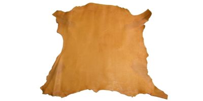 Full-grain honey basane leather hide, vegetable tanned sheepskin on white background