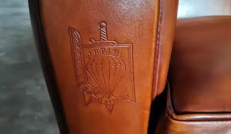 Fully customizable sheepskin leather marking on the armrest of a club chair