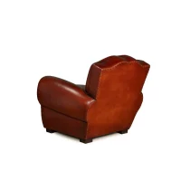 Cognac Grand Moustache leather club chair, in 3/4 back view