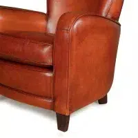 Cognac Bridge leather club chair, zoom on an armrest