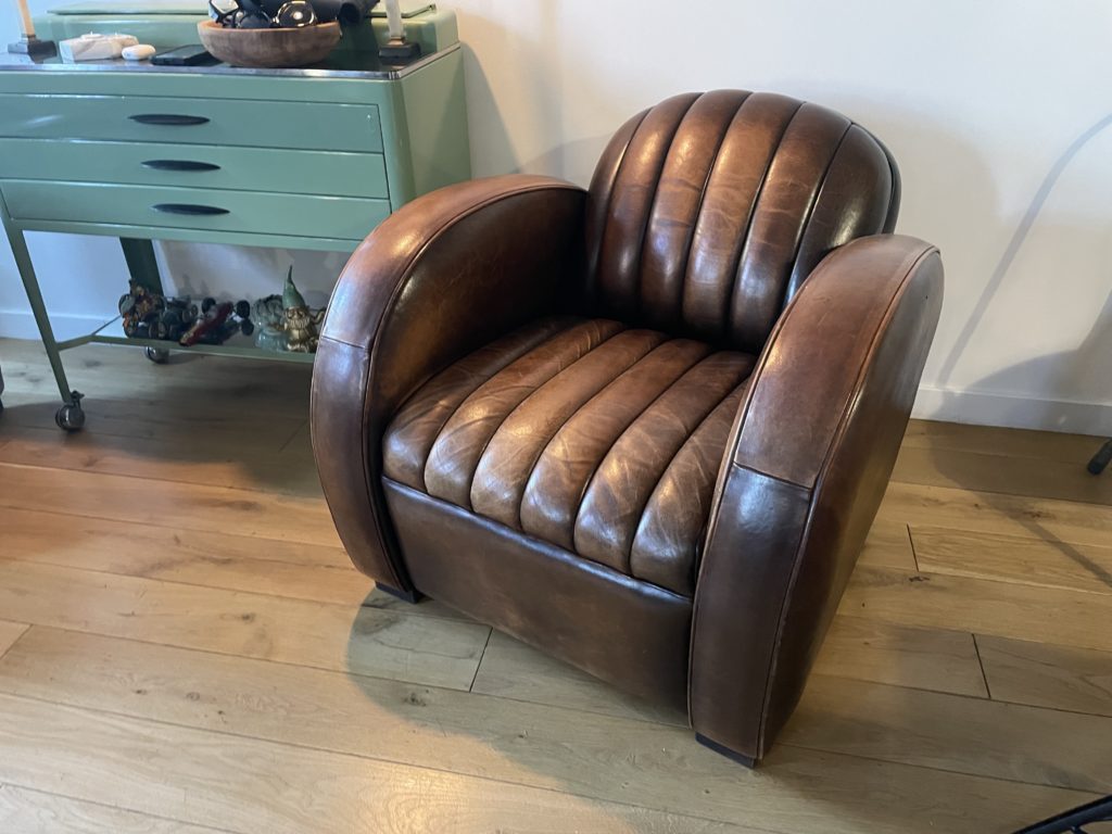 Corvette club chair in chocolate leather with a vintage patina